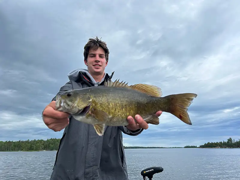 Lake of the WoodsBass Fishing Guest holding a large bass while fishing on Lake of the Woods in Northwestern Ontario.