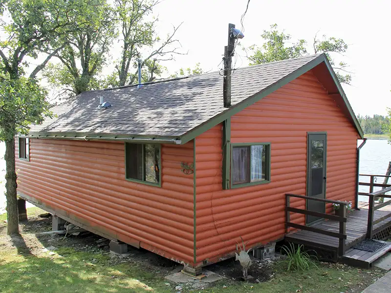 Cabin Accommodations at Grassy Narrows Lodge Red cabin accommodations at Grassy Narrows Lodge in Miles Bay on Lake of the Woods.
