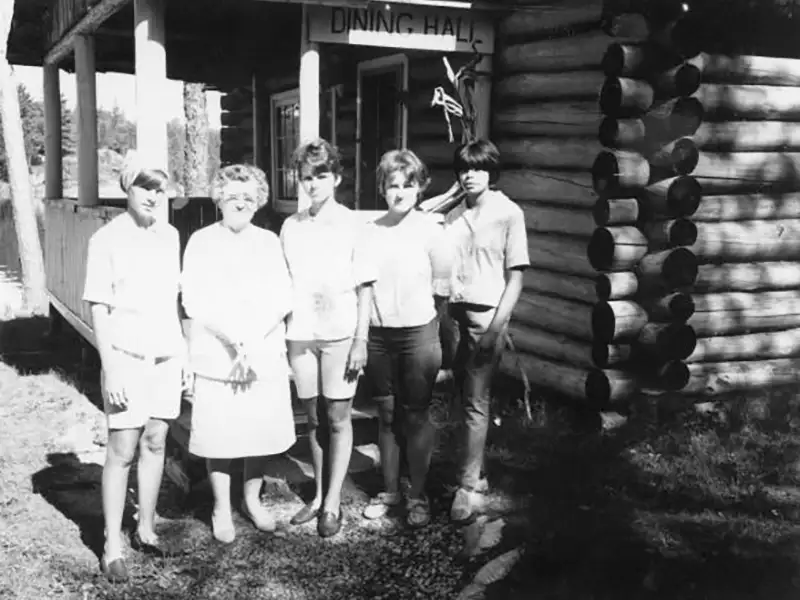 Original Dining Hall at Grassy Narrows Lodge Historic photo of guests outside the original dining hall at Grassy Narrows Lodge in the early years.