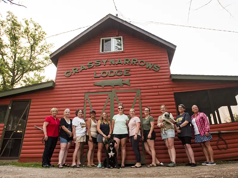 Guests at Grassy Narrows Lodge Guests gather in front of the main lodge building at Grassy Narrows Lodge in Miles Bay, Ontario.