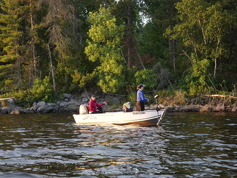 Lake of the Woods Fishing Trip Guests fishing from a boat near Grassy Narrows Lodge on Lake of the Woods in Morson, Ontario.