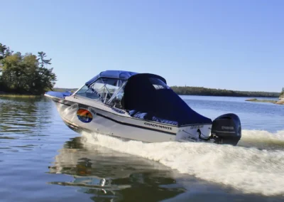 Grassy Narrows Lodge boat traveling across Lake of the Woods