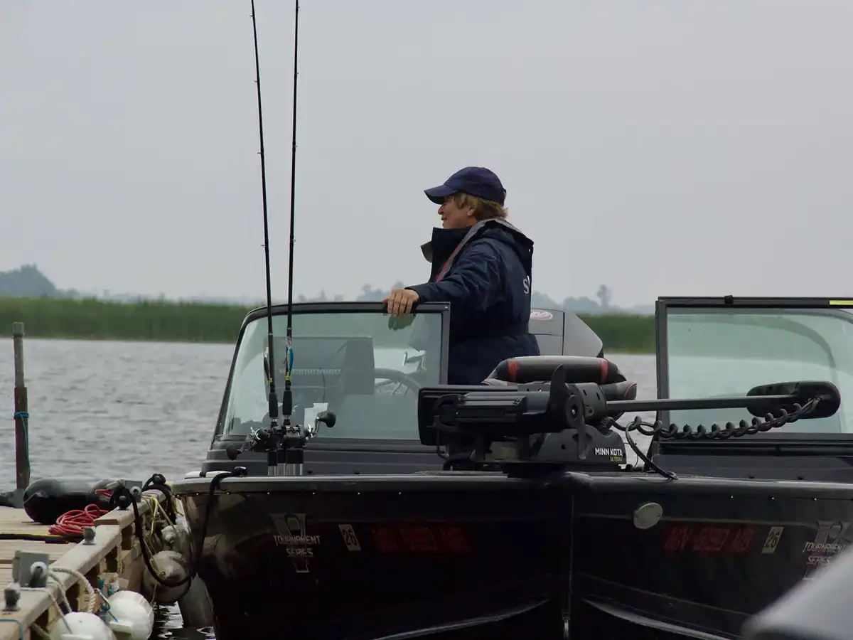 Kay Hawley fishing from her boat during Women's Week