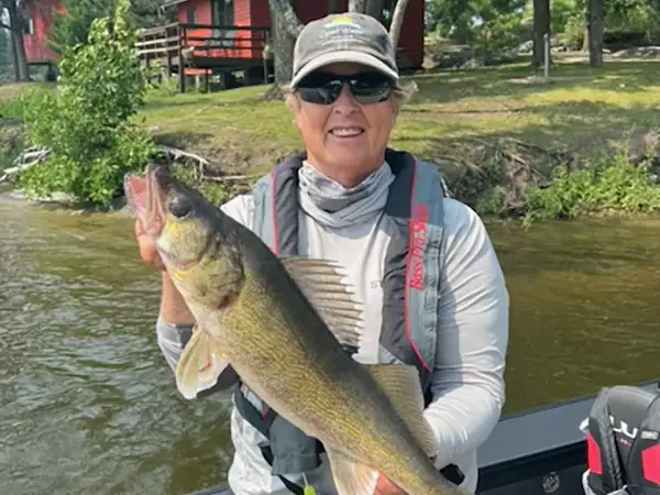 Kay Hawley fishing from her boat during Women's Week