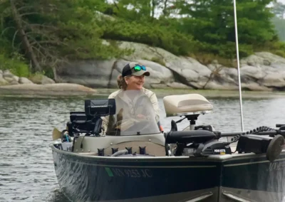Woman fishing from a boat on Lake of the Woods in Ontario